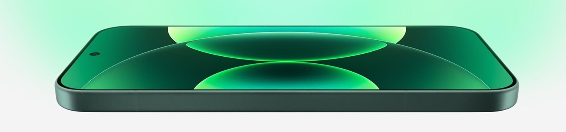 Xiaomi 17 in Grün, flach liegend mit eingeschaltetem Display und grüner Kreisgrafik