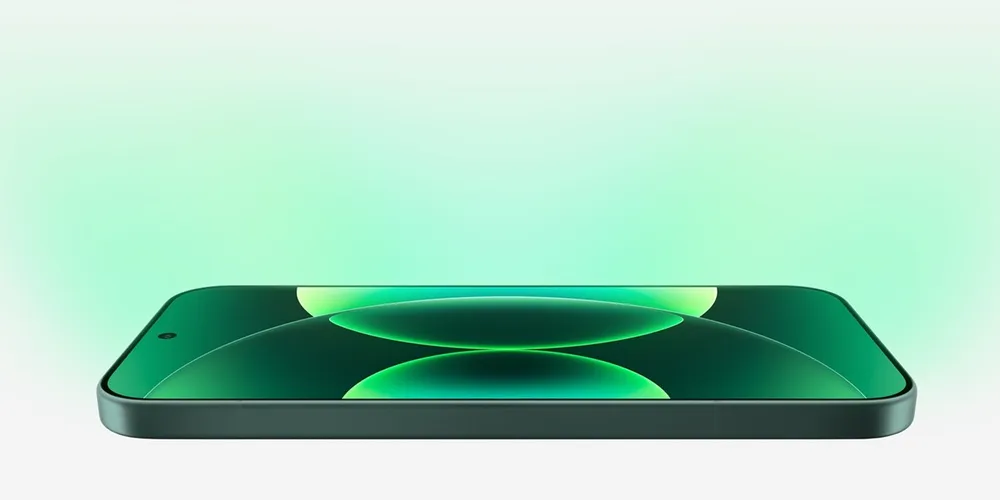 Xiaomi 17 in Grün, flach liegend mit eingeschaltetem Display und grüner Kreisgrafik