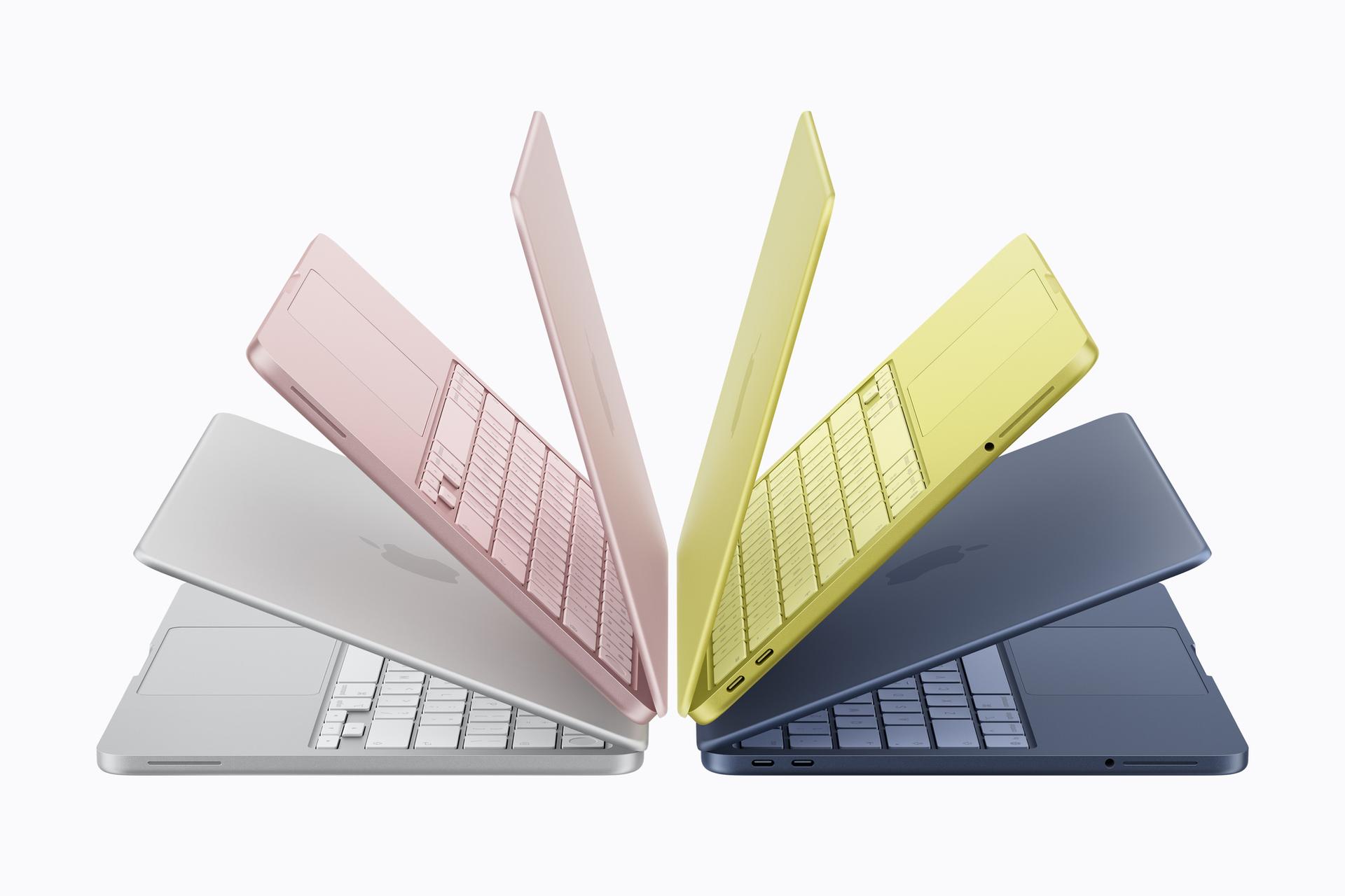 MacBook Neo Modelle in verschiedenen Farben (Silber, Rosé, Gelb und Blau), halb aufgeklappt und spiegelbildlich angeordnet